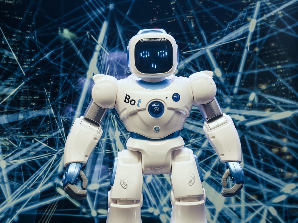 Free White and Blue Robot Figure Stock Photo