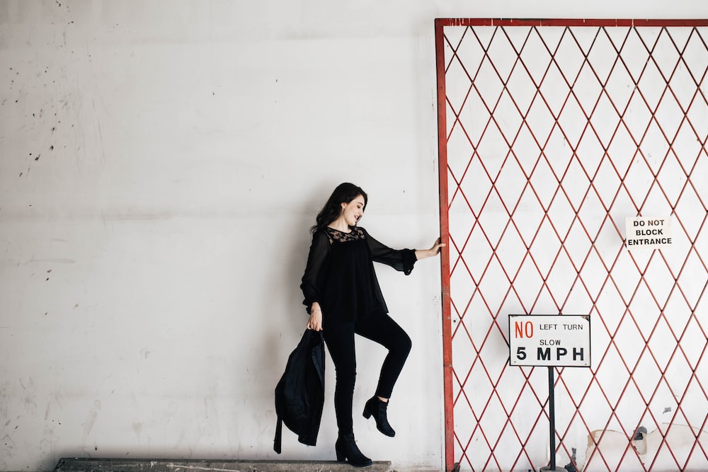 woman carrying black bag