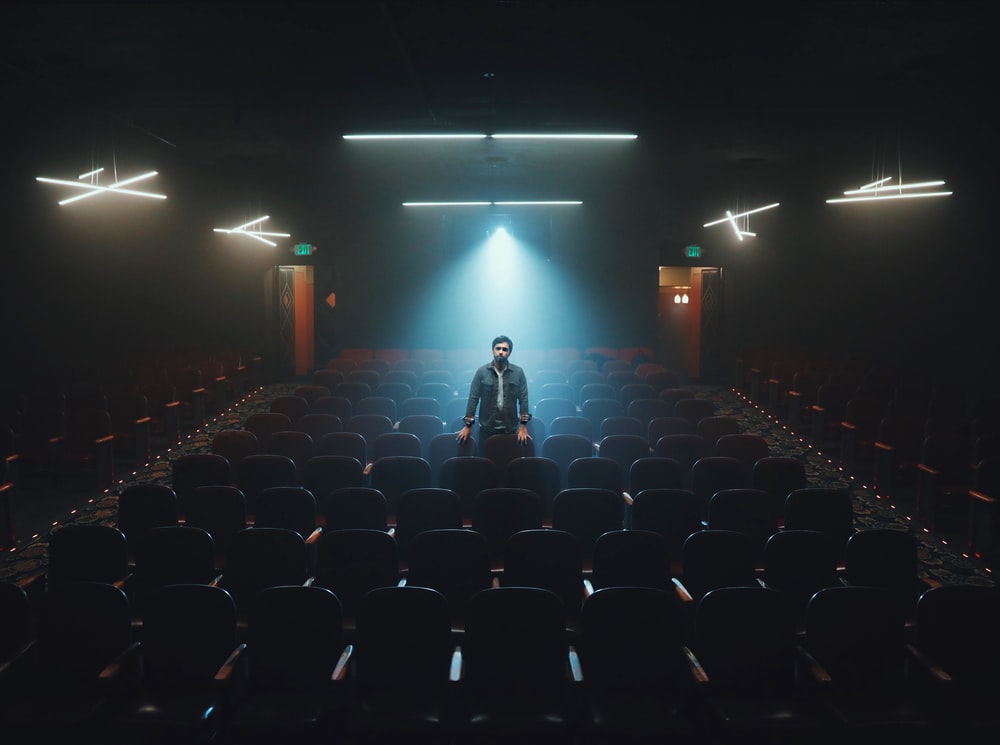 man standing in cinema