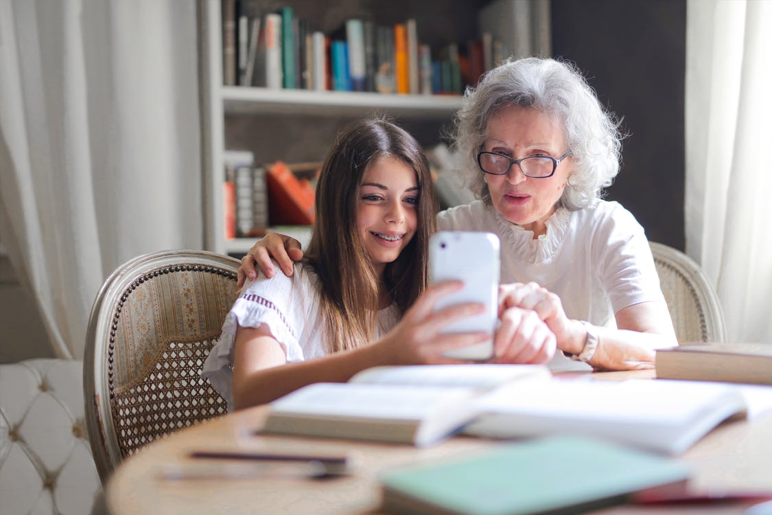 Free Photo of Woman Showing Her Cellphone to Her Grandmother Stock Photo