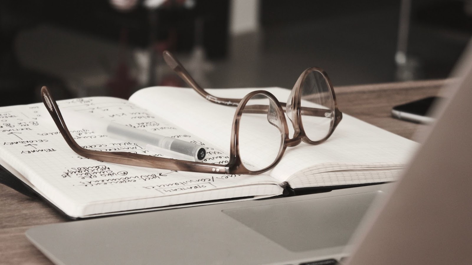 Eyeglasses on white background with various text and automotive design elements.